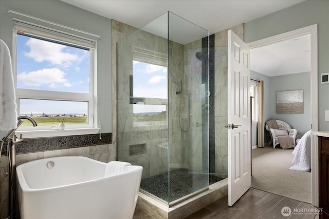 179 Perry Dr, Coupeville, WA 98239 - bathroom with a freestanding tub, plenty of natural light, a shower stall, and wood finished floors