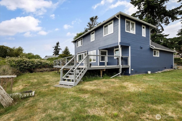 179 Perry Dr, Coupeville, WA 98239 - rear view of house featuring a deck and a lawn