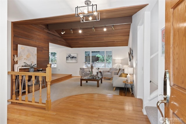 3420 210th Pl NE, Sammamish, WA 98074 - living area featuring track lighting, a chandelier, and wooden walls