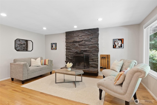 3420 210th Pl NE, Sammamish, WA 98074 - living room featuring wood finished floors, a stone fireplace, and recessed lighting
