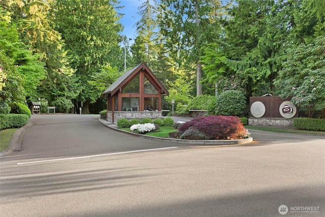 3420 210th Pl NE, Sammamish, WA 98074 - view of front of home featuring stone siding and view of wooded area