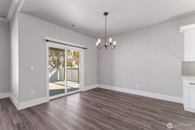 1300 W Marina Dr Unit 33, Moses Lake, WA 98837 - unfurnished dining area featuring dark wood-style floors and a chandelier