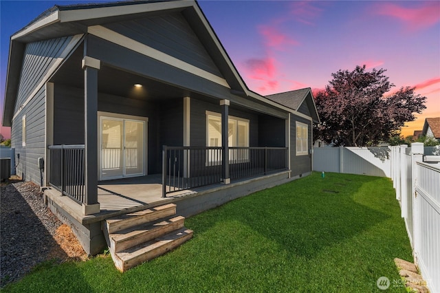 1300 W Marina Dr Unit 33, Moses Lake, WA 98837 - back of house at dusk with a fenced backyard