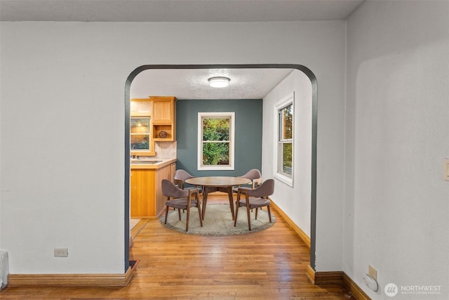 123 Scenic View Dr, Longview, WA 98632 - dining space featuring light wood finished floors and arched walkways