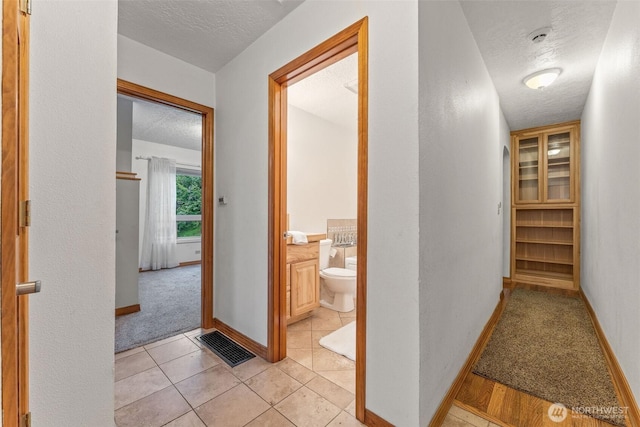 123 Scenic View Dr, Longview, WA 98632 - corridor with a textured ceiling and light carpet