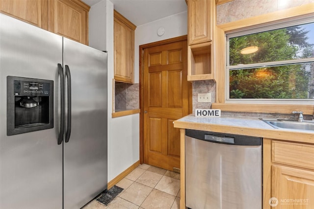 123 Scenic View Dr, Longview, WA 98632 - kitchen with stainless steel appliances, decorative backsplash, and light tile patterned floors