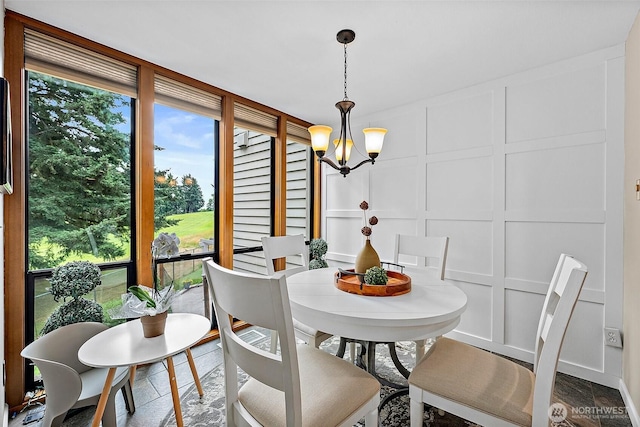 2313 S Cedar St Unit 107, Tacoma, WA 98405 - dining area with a decorative wall, healthy amount of natural light, and a chandelier