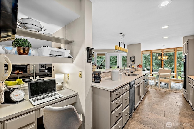 2313 S Cedar St Unit 107, Tacoma, WA 98405 - kitchen featuring gray cabinets, light countertops, decorative light fixtures, recessed lighting, and a chandelier