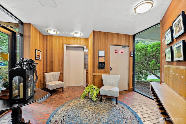 2313 S Cedar St Unit 107, Tacoma, WA 98405 - building lobby featuring wooden walls and a textured ceiling