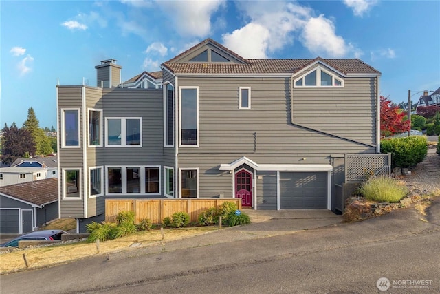 3519 N Union Ave Unit 2, Tacoma, WA 98407 - view of front of house with a garage, a tiled roof, and a chimney