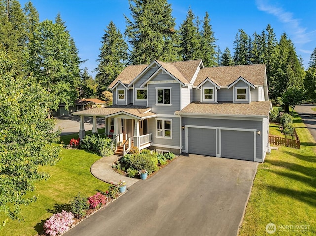32701 SE 43rd St, Fall City, WA 98024 - view of front of property with a porch, asphalt driveway, a front lawn, and roof with shingles