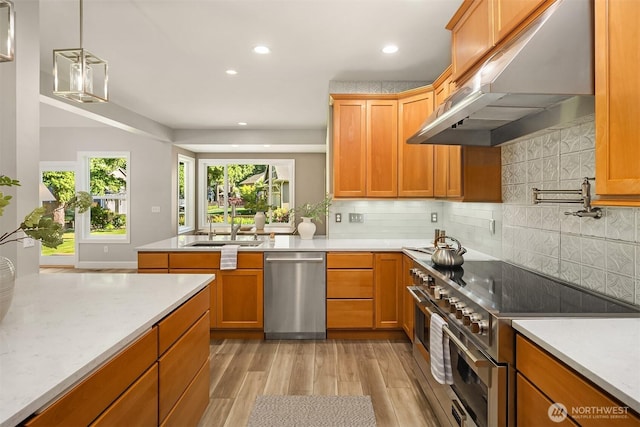 32701 SE 43rd St, Fall City, WA 98024 - kitchen with stainless steel appliances, extractor fan, light wood-style floors, recessed lighting, and tasteful backsplash