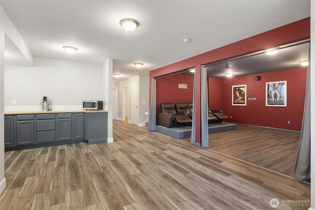 32701 SE 43rd St, Fall City, WA 98024 - bar with light wood-style floors and stainless steel microwave