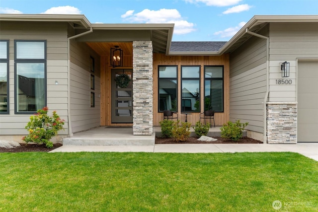 18500 NE 79th, Vancouver, WA 98682 - property entrance featuring a garage, a yard, a porch, and stone siding
