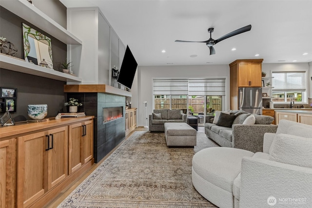 18500 NE 79th, Vancouver, WA 98682 - living area featuring a fireplace, light wood-type flooring, recessed lighting, and ceiling fan