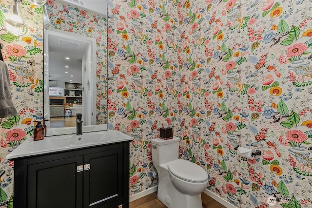 18500 NE 79th, Vancouver, WA 98682 - half bathroom with wallpapered walls, vanity, and wood finished floors
