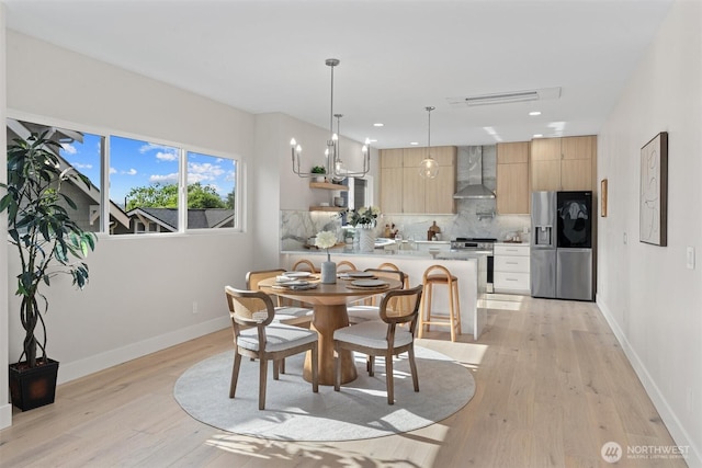 320 NW 51st St Unit A, Seattle, WA 98107 - dining space featuring light wood finished floors and recessed lighting