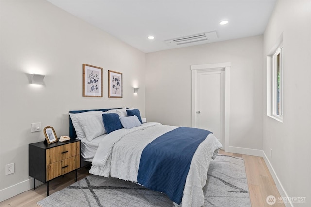 320 NW 51st St Unit A, Seattle, WA 98107 - bedroom with light wood-type flooring and recessed lighting