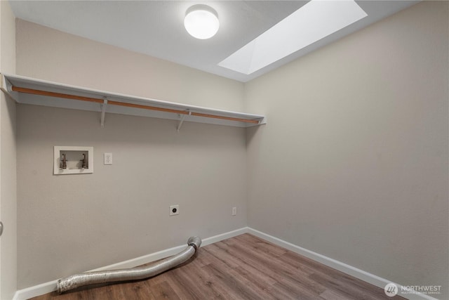 9910 Fairview Lake Rd SW, Port Orchard, WA 98367 - laundry area with a skylight, hookup for an electric dryer, hookup for a washing machine, and wood finished floors