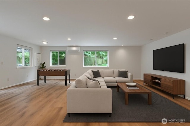 20111 124th St E, Bonney Lake, WA 98391 - living area featuring a wall mounted AC, light wood-style flooring, and recessed lighting