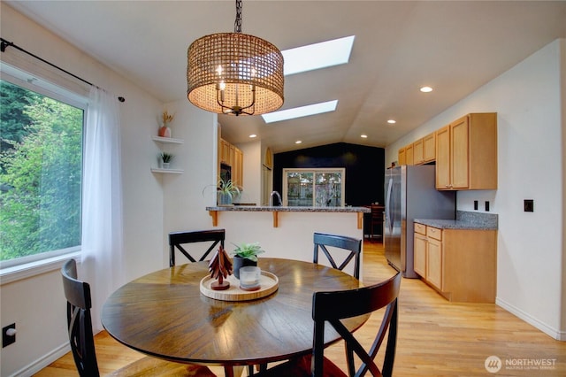 4031 Alyssa Ct, Bellingham, WA 98226 - dining area with a skylight, light wood-type flooring, recessed lighting, lofted ceiling, and a chandelier