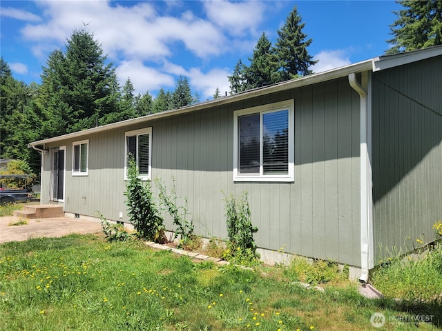 17311 154th Way SE, Yelm, WA 98597 - view of side of home with a lawn and crawl space