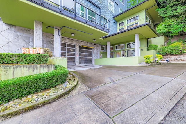 655 Crockett St Unit B304, Seattle, WA 98109 - doorway to property with a garage and concrete driveway