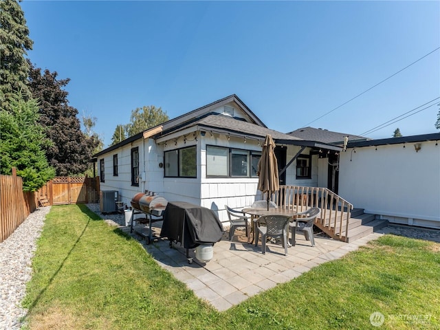 1018 Vassar Ave, Wenatchee, WA 98801 - back of property with a fenced backyard and a patio