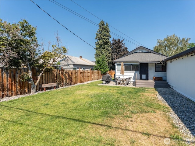 1018 Vassar Ave, Wenatchee, WA 98801 - fenced backyard featuring entry steps and a patio area