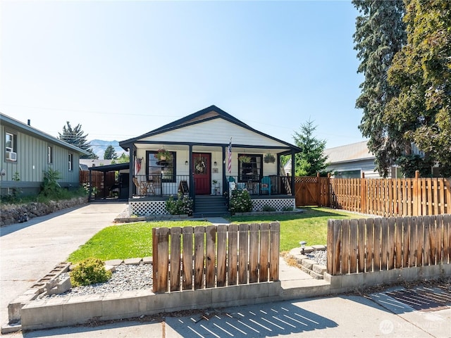 1018 Vassar Ave, Wenatchee, WA 98801 - shotgun-style home with covered porch and driveway