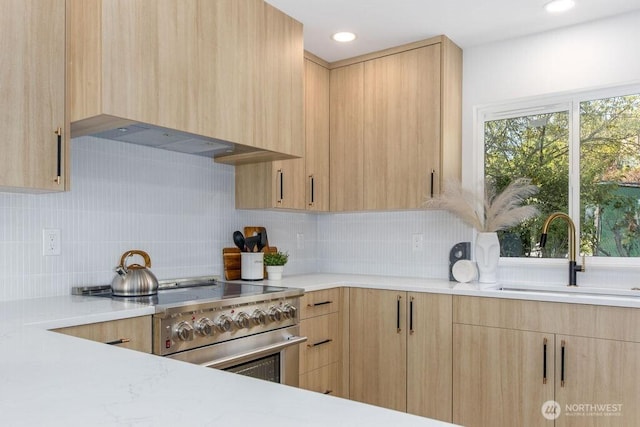 2216 18th Ave S, Seattle, WA 98144 - kitchen with light brown cabinets, high end range, decorative backsplash, and extractor fan