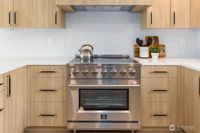2216 18th Ave S, Seattle, WA 98144 - kitchen with high end stove, light brown cabinetry, light countertops, tasteful backsplash, and exhaust hood
