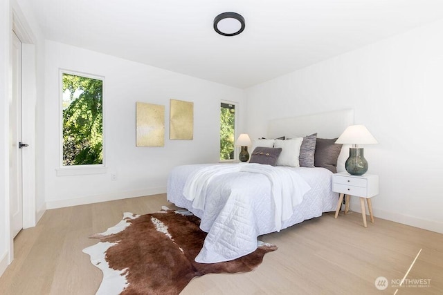 2216 18th Ave S, Seattle, WA 98144 - bedroom with multiple windows and wood finished floors