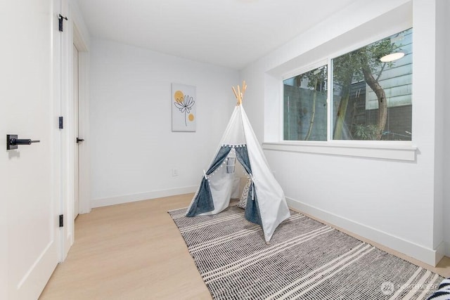 2216 18th Ave S, Seattle, WA 98144 - game room with light wood-style flooring and baseboards