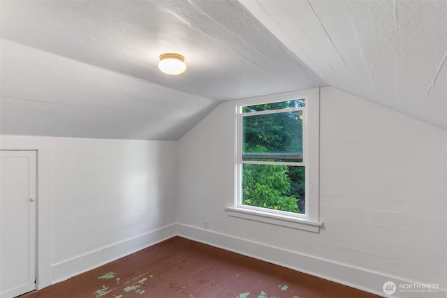 212 SE Cowlitz Rd, Winlock, WA 98596 - additional living space featuring vaulted ceiling and dark wood-type flooring