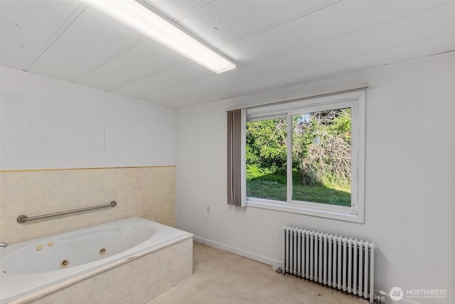 212 SE Cowlitz Rd, Winlock, WA 98596 - bathroom with radiator heating unit and a tub with jets