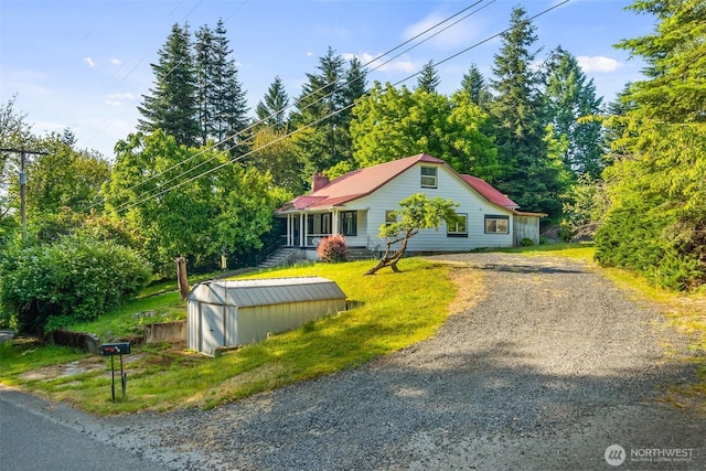 212 SE Cowlitz Rd, Winlock, WA 98596 - bungalow-style house with gravel driveway and a storage shed