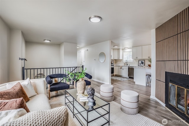 1415S 93rd St, Tacoma, WA 98444 - living area featuring light wood-style flooring and a glass covered fireplace