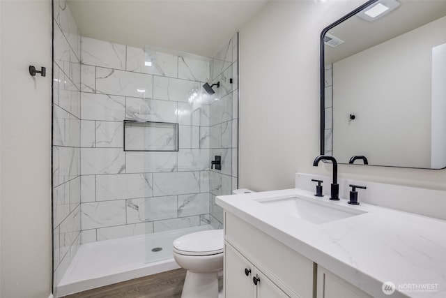 1415S 93rd St, Tacoma, WA 98444 - full bathroom with vanity, a tile shower, and wood finished floors