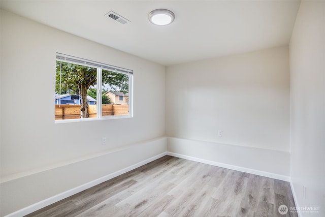 1415S 93rd St, Tacoma, WA 98444 - empty room with light wood-style floors and baseboards