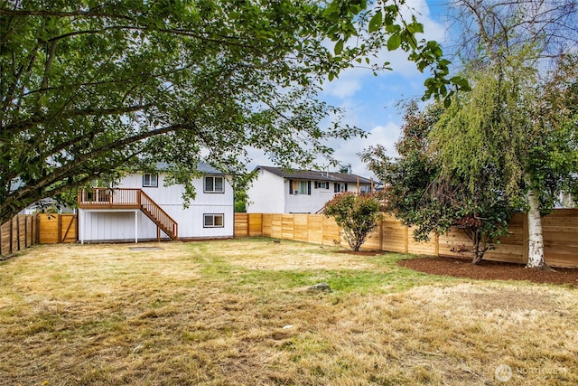 1415S 93rd St, Tacoma, WA 98444 - fenced backyard with stairs and a wooden deck