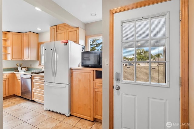 720 N Forest St, Bellingham, WA 98225 - kitchen featuring stainless steel dishwasher, freestanding refrigerator, black microwave, light tile patterned flooring, and recessed lighting