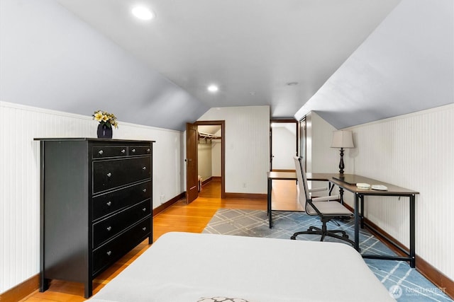 720 N Forest St, Bellingham, WA 98225 - bedroom with wood finished floors, vaulted ceiling, and a spacious closet