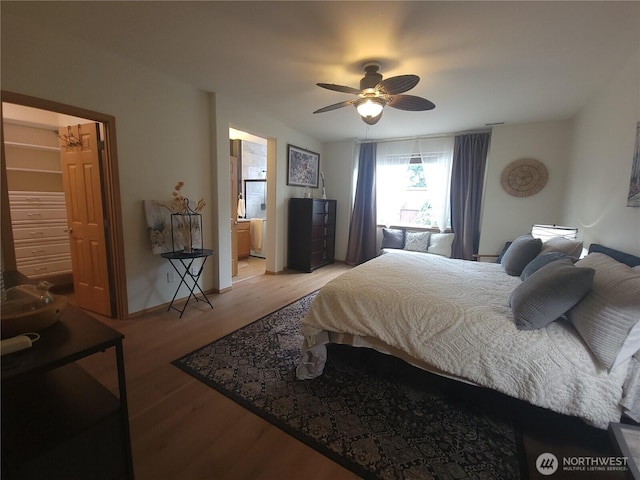 8542 Bainbridge Loop NE, Lacey, WA 98516 - bedroom with light wood-type flooring, a ceiling fan, and ensuite bath