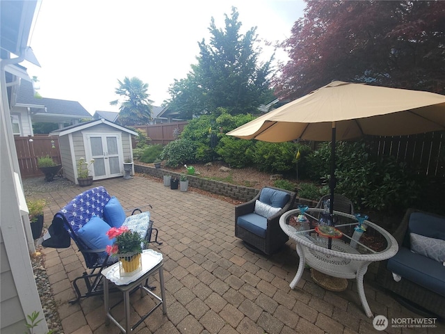 8542 Bainbridge Loop NE, Lacey, WA 98516 - fenced backyard with a patio area, an outbuilding, an outdoor living space, and french doors
