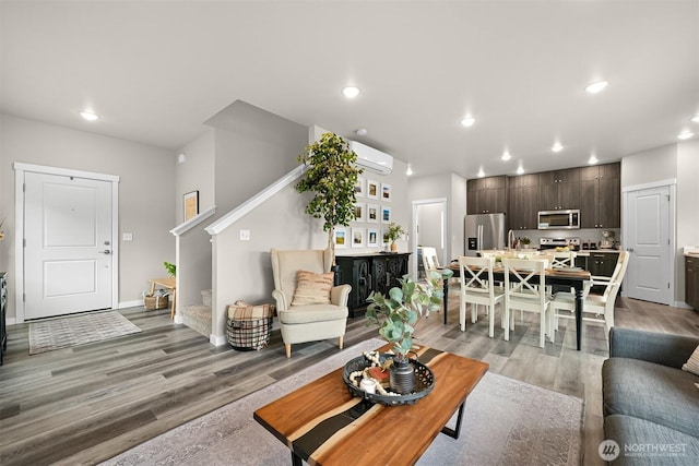 2649 Sandwood Ln, Blaine, WA 98230 - living area with light wood-type flooring, recessed lighting, stairs, and a wall mounted air conditioner