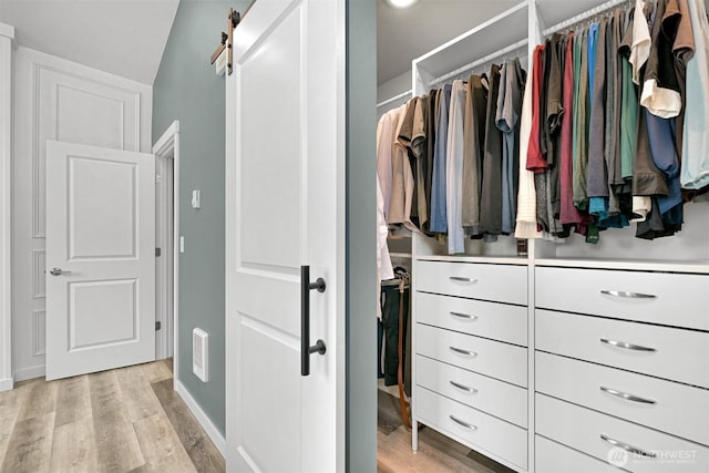 2649 Sandwood Ln, Blaine, WA 98230 - walk in closet with light wood-style flooring