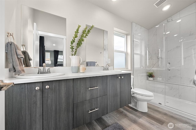 2649 Sandwood Ln, Blaine, WA 98230 - full bath with double vanity, a marble finish shower, wood finished floors, lofted ceiling, and recessed lighting