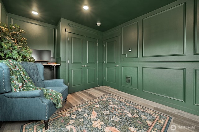 2649 Sandwood Ln, Blaine, WA 98230 - sitting room with wood finished floors, a decorative wall, and recessed lighting