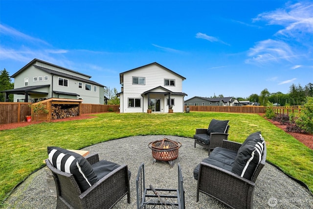 2649 Sandwood Ln, Blaine, WA 98230 - rear view of house featuring an outdoor fire pit, a fenced backyard, and a patio